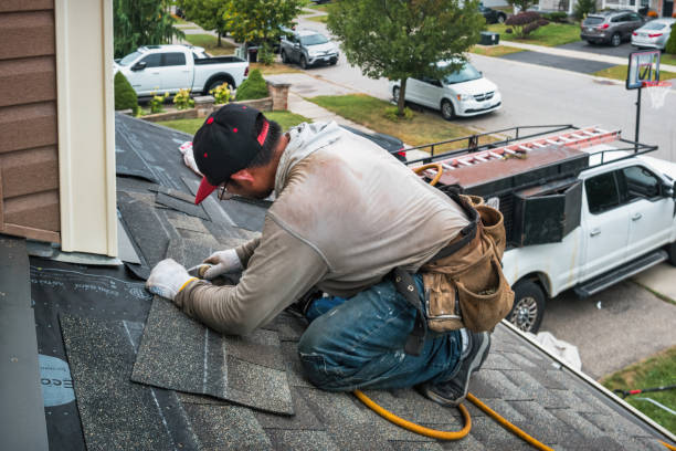 Professional Roofing technician working in Rogers, TX